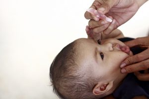 a-child-receives-an-oral-vaccine-by-world-bank-photo-collection-in-flikr-cc-by-nc-nd-2-0